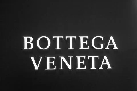 The "BOTTEGA VENETA" logo features white letters on a black background Stock Photos