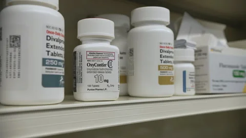 Bottle of 10mg OxyContin Pills on Shelf Stock Footage 301886376