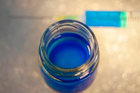Bottle and Syringe With Same Liquid Stock Photos