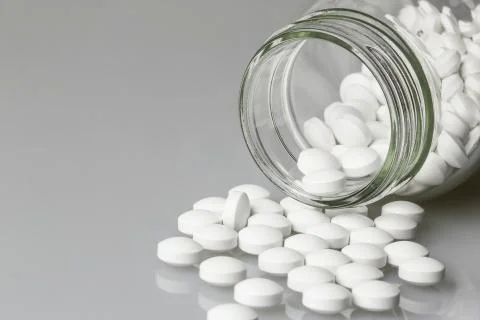 A bottle and tablets Stock Photos