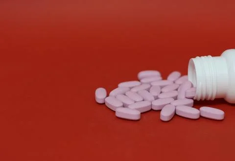 Bottle and tablets Stock Photos