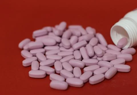 Bottle and tablets Stock Photos