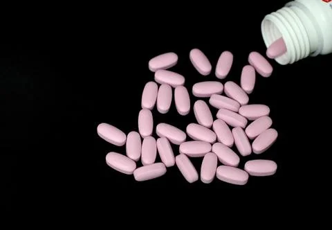 Bottle and tablets Stock Photos