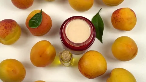 Bottle with apricot kernel oil and jar with cosmetic cream Stock Footage 278038521