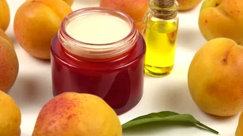 Bottle with apricot kernel oil and jar with cosmetic cream Stock Footage 278038739