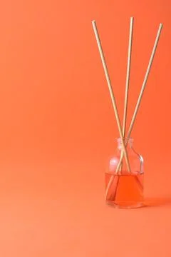 Bottle of aroma diffuser isolated on orange backgrou Foto stock
