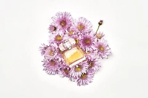 Bottle of aromatic perfume with flowers Stock Photos