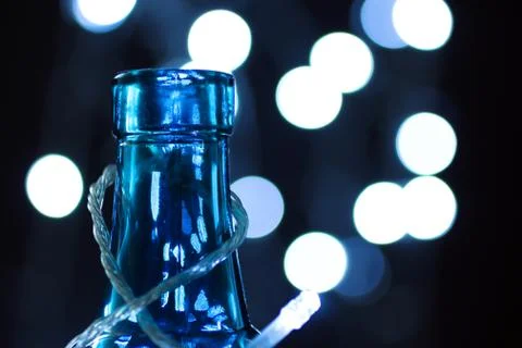 Bottle on the background of lights Stock Photos