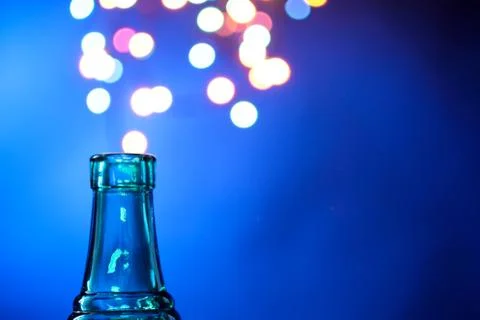 Bottle on the background of lights Stock Photos
