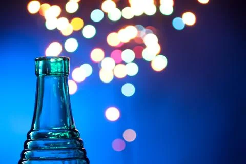 Bottle on the background of lights Stock Photos