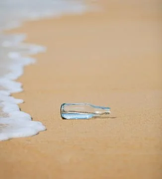 Bottle on the beach Stock Photos