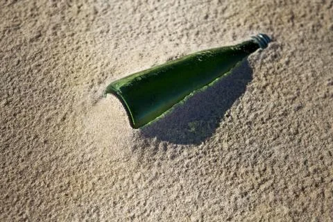 Bottle on the beach Stock Photos