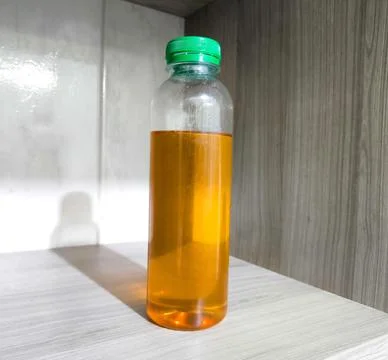 Bottle with bee honey Stock Photos