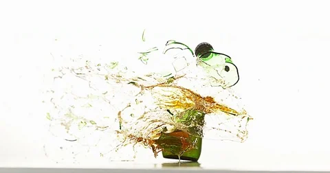 Bottle of Beer Breaking and Splashing against White Background, Slow motion 4K Stock Footage 75977154