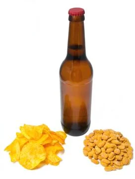 The bottle beer with chips and peanuts Stock Photos