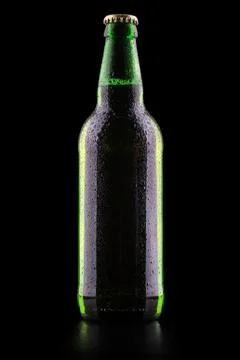 Bottle of beer with drops Stock Photos