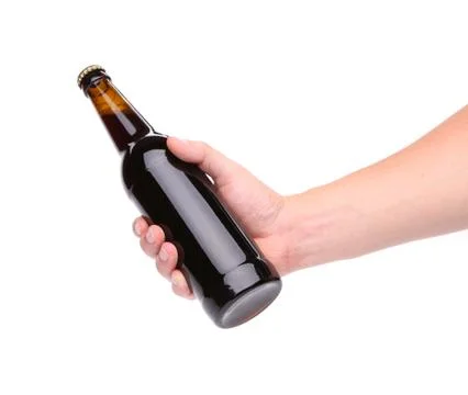 A bottle of beer in a hand Stock Photos