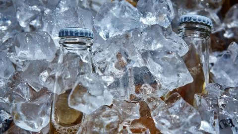 Bottle of beer is in ice 写真素材