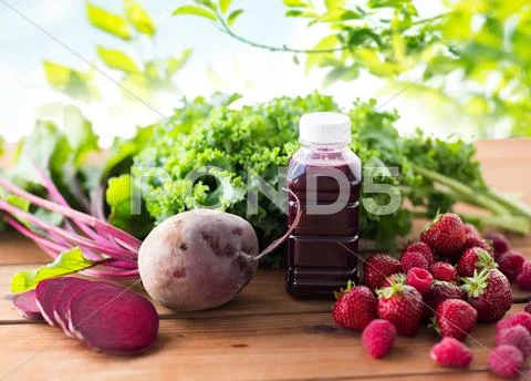 Bottle with beetroot juice, fruits and vegetables Stock Photos