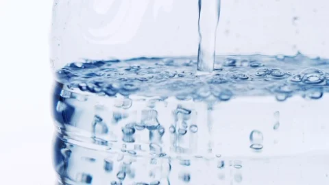 A bottle is being filled with water Stock Footage 73610292