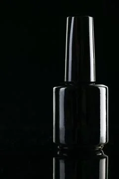 Bottle with black varnish Stock Photos