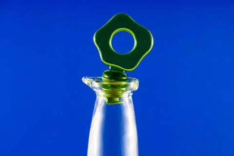 Bottle on a blue background Stock Photos