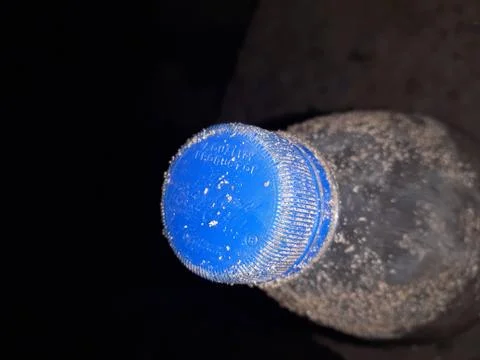 A bottle with a blue background Foto stock
