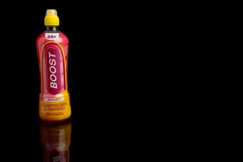 A Bottle of Boost Sport Raspberry &amp; Mango  against a black background Stock Photos