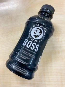 Bottle of Boss coffee on the table Stock Photos