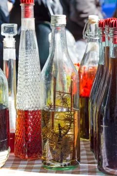 Bottle of brandy with branch Stock Photos