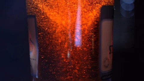 Bottle of brandy or whiskey. Macro shot. Abstract Gold Light Sparkles and rays Stock Footage 109037356