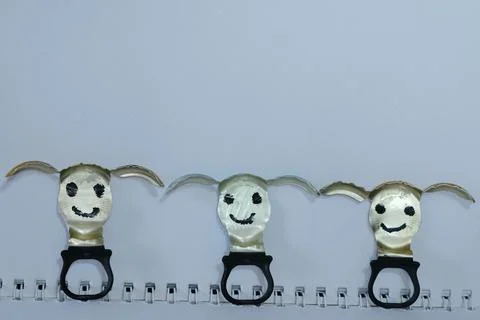 Bottle cap characters smiling in a row Stock Photos