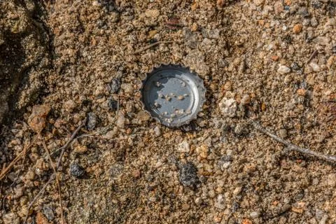 Bottle cap on the ground Stock Photos