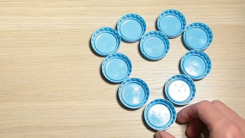 Bottle cap hand wooden table background hd footage Stock Footage 119524009