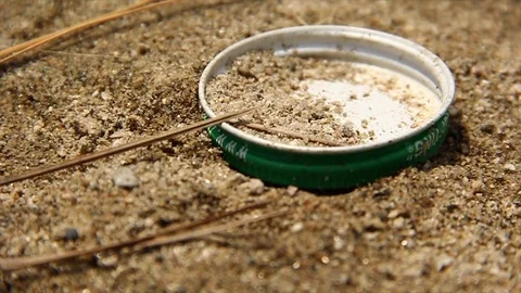 Bottle Cap Litter Stock Footage 83558406