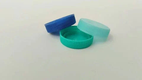 Bottle cap made of plastic on white background Video stock 310868806