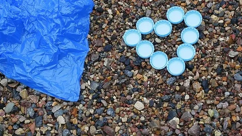 Bottle cap polyethylene package stone background hd footage Stock Footage 119862342