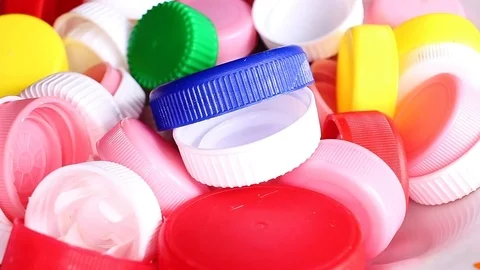 Bottle caps colorful rotating texture pattern closeup footage Stock Footage 97235598