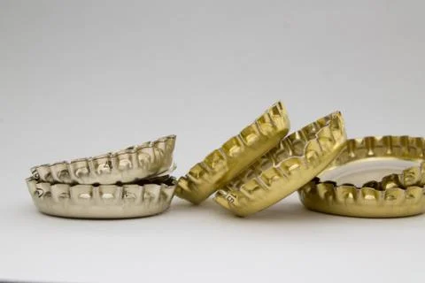 Bottle caps on gray background Stock Photos