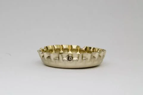 Bottle caps on gray background Stock Photos