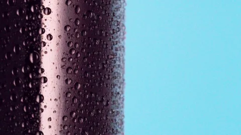 Bottle of carbonated soft drink covered with condensate, close shot. Dolly shot Stock Footage 128469835