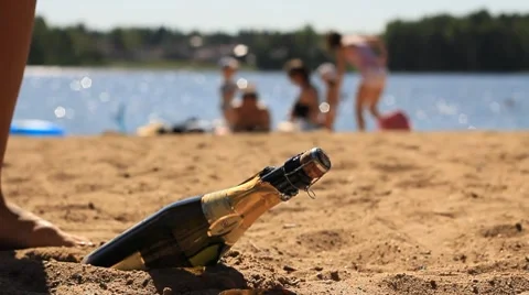 Bottle of champagne on the beach Stock Footage 7727996