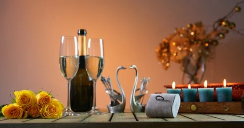 Bottle of champagne with two glasses. Romantic evening. Engagement ring. An Video stock 91882016
