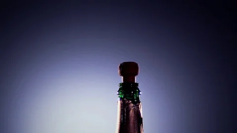 Bottle champagne wine is opened. Slow motion, lit background 스톡 동영상 73497909