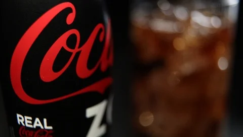 Bottle of Coca Cola Zero and Glass with the Ice Cubes Stock Footage 99828107