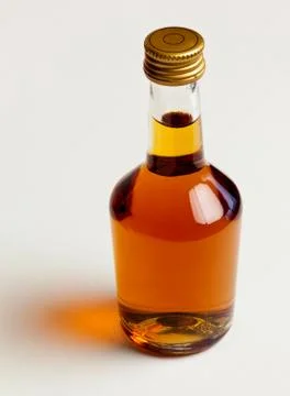 Bottle of cognac with reflection Stock Photos