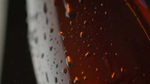 A bottle of cold beer on a black background. A drop flows down from the bottle. Stock Footage 146126067