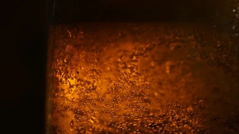 A bottle of cold beer with bubble in slow motion on a black background Stock-Footage 115631865