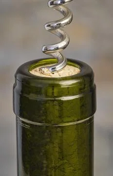 Bottle with cork and corkscrew Stock Photos