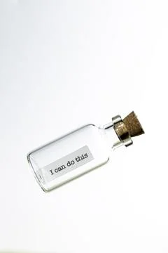 Bottle with a cork and message Stock Photos